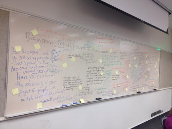Post-it notes indicate thematic groupings for ideas on social justice digital humanities. 